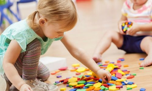 little girl playing in creche